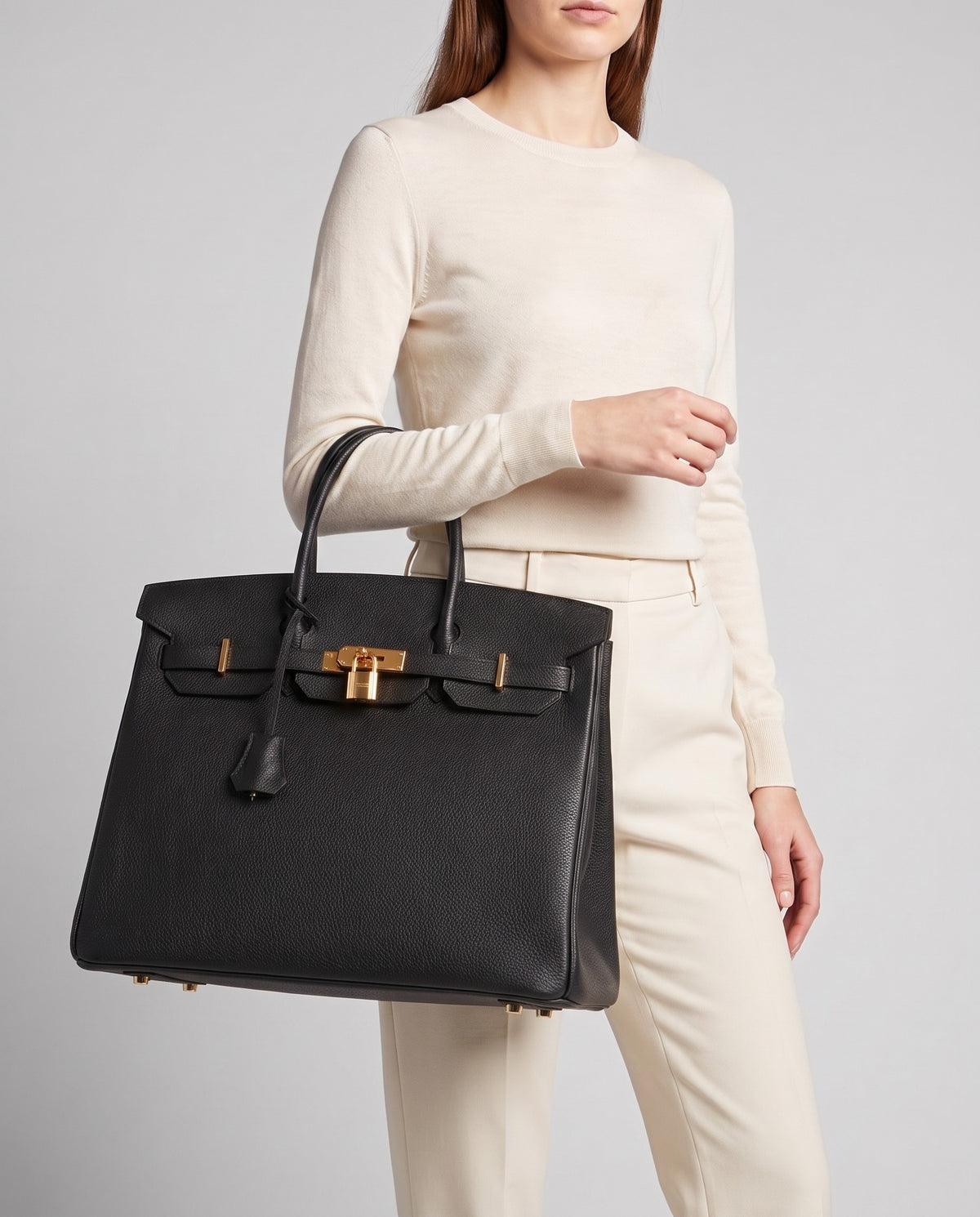 Lock Extra Large leather top-handle bag in Black – model carrying it