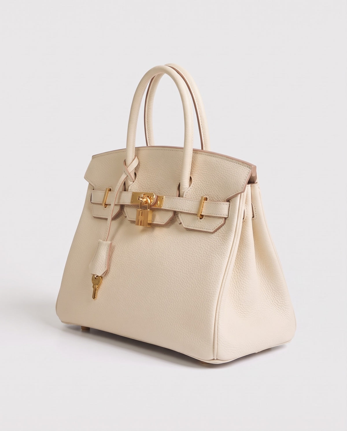 Lock Extra Large leather top-handle bag in Cream – three-quarter view
