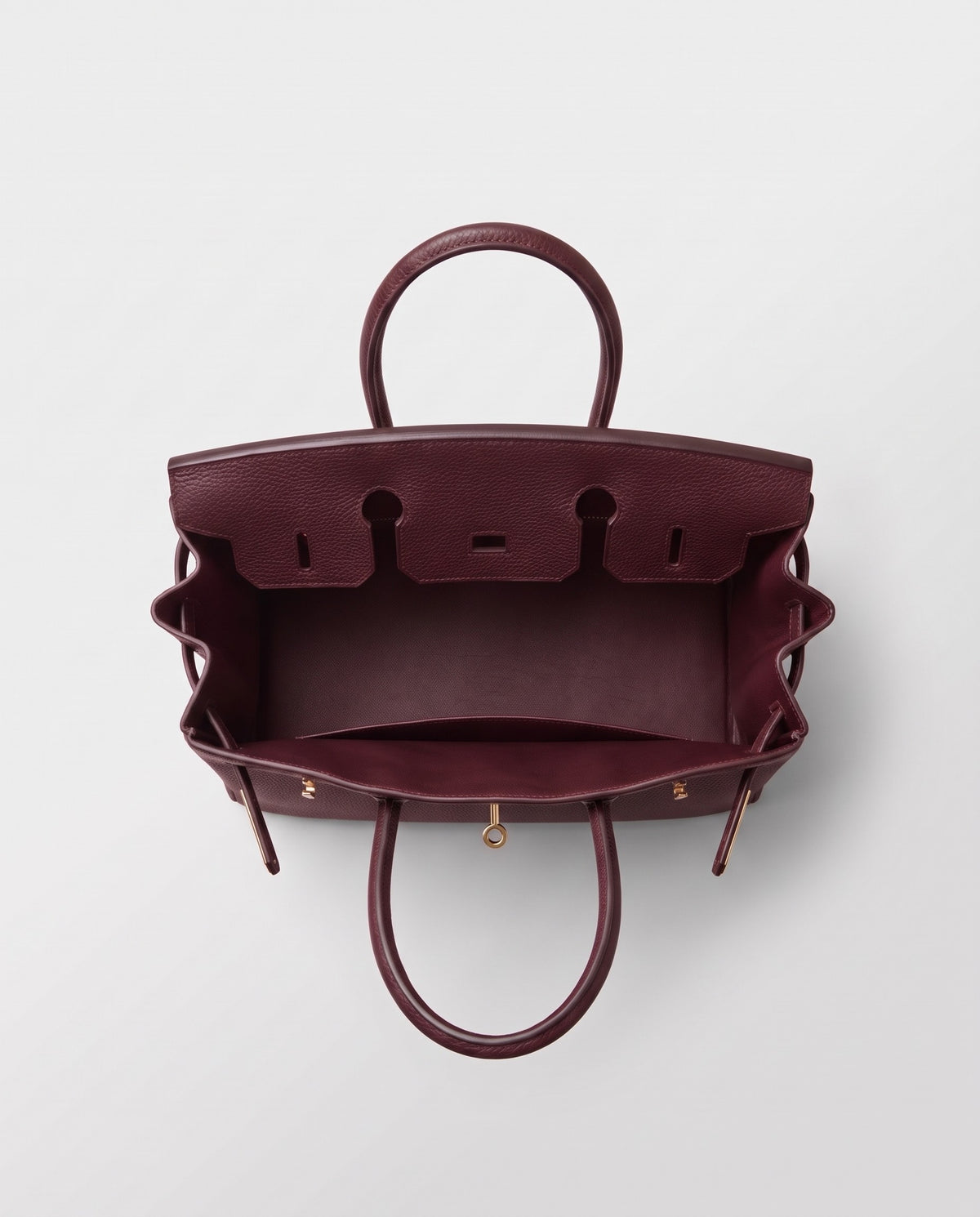 Lock Medium leather top-handle bag in Bordeaux – inside view showing the leather lining