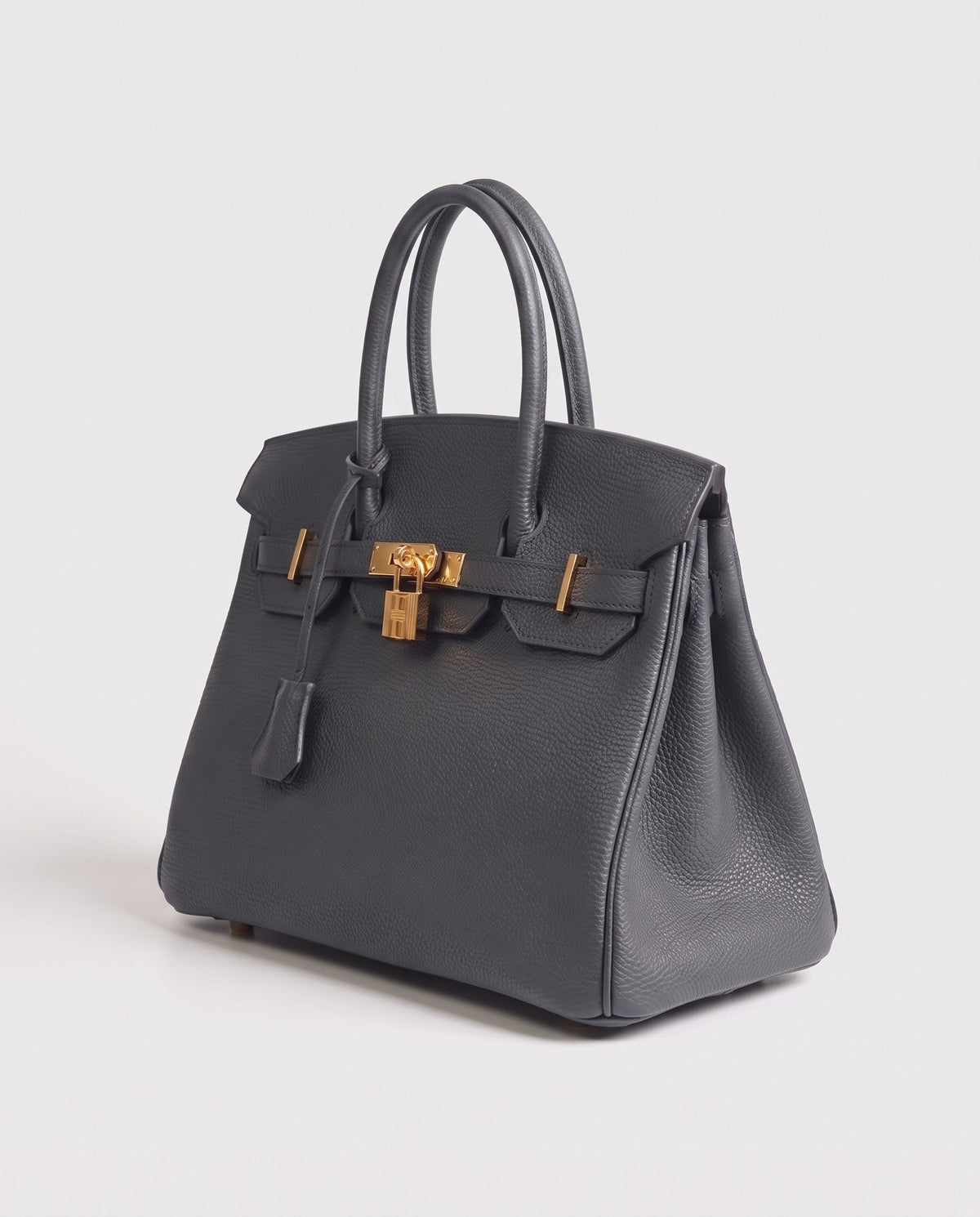 Lock Medium leather top-handle bag in Charcoal – three-quarter view