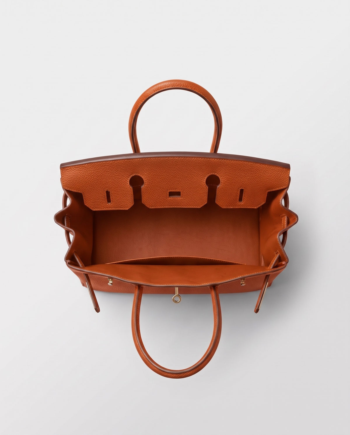 Lock Medium leather top-handle bag in Terracotta – inside view showing the leather lining