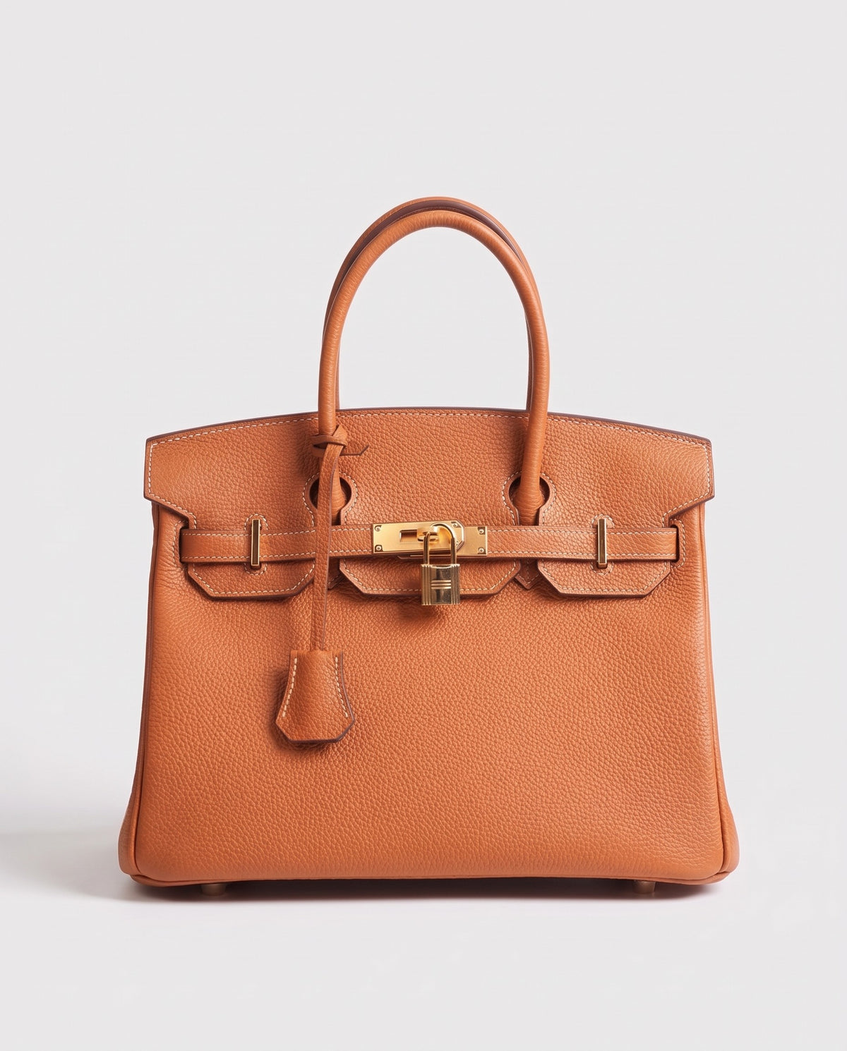 Lock Small leather top-handle bag in Caramel – front view