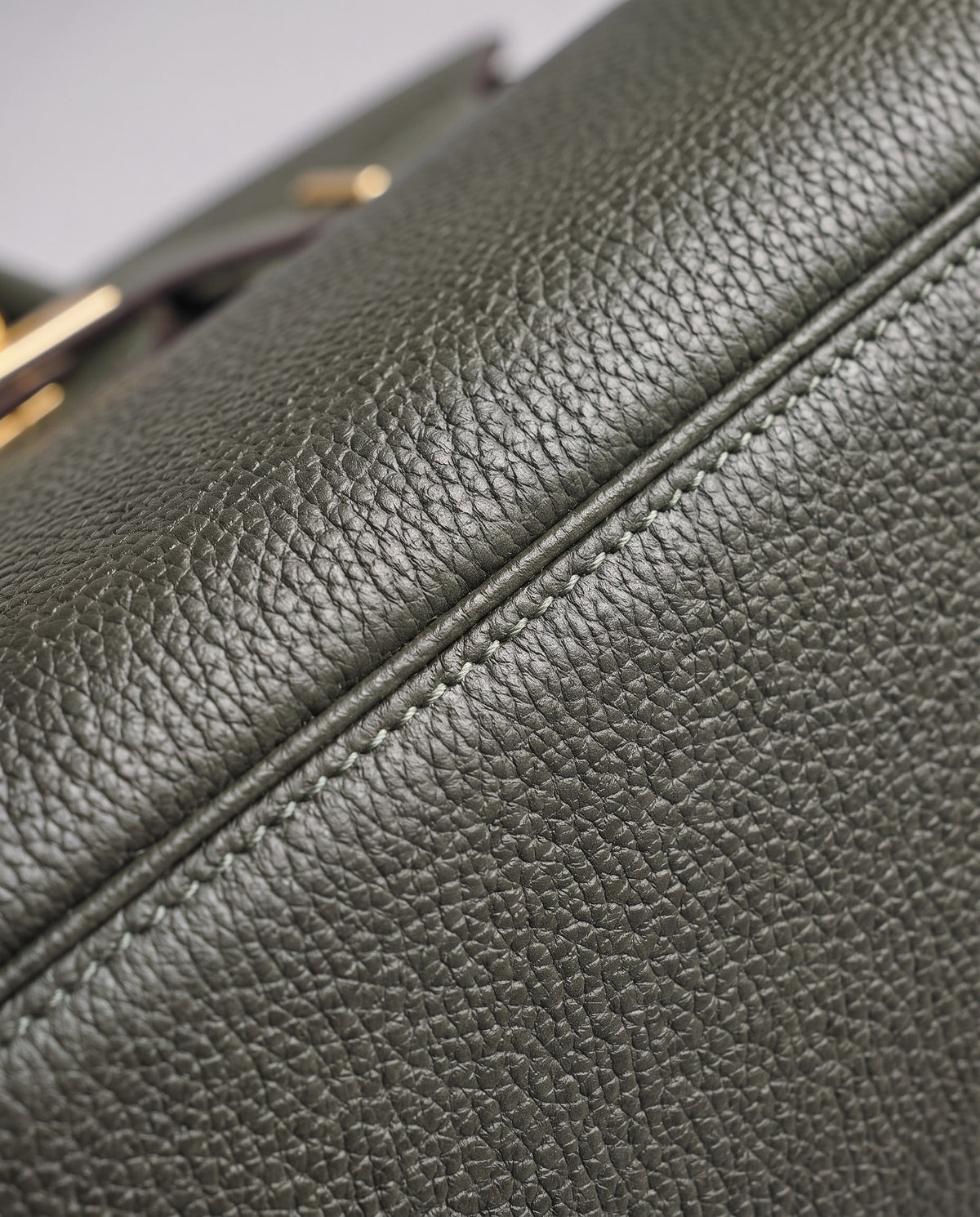 Lock Small leather top-handle bag in Celadon – close-up of the pebbled leather and stitching
