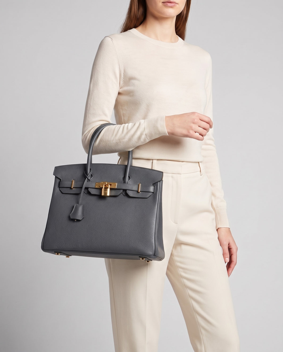 Lock Small leather top-handle bag in Charcoal – model carrying it