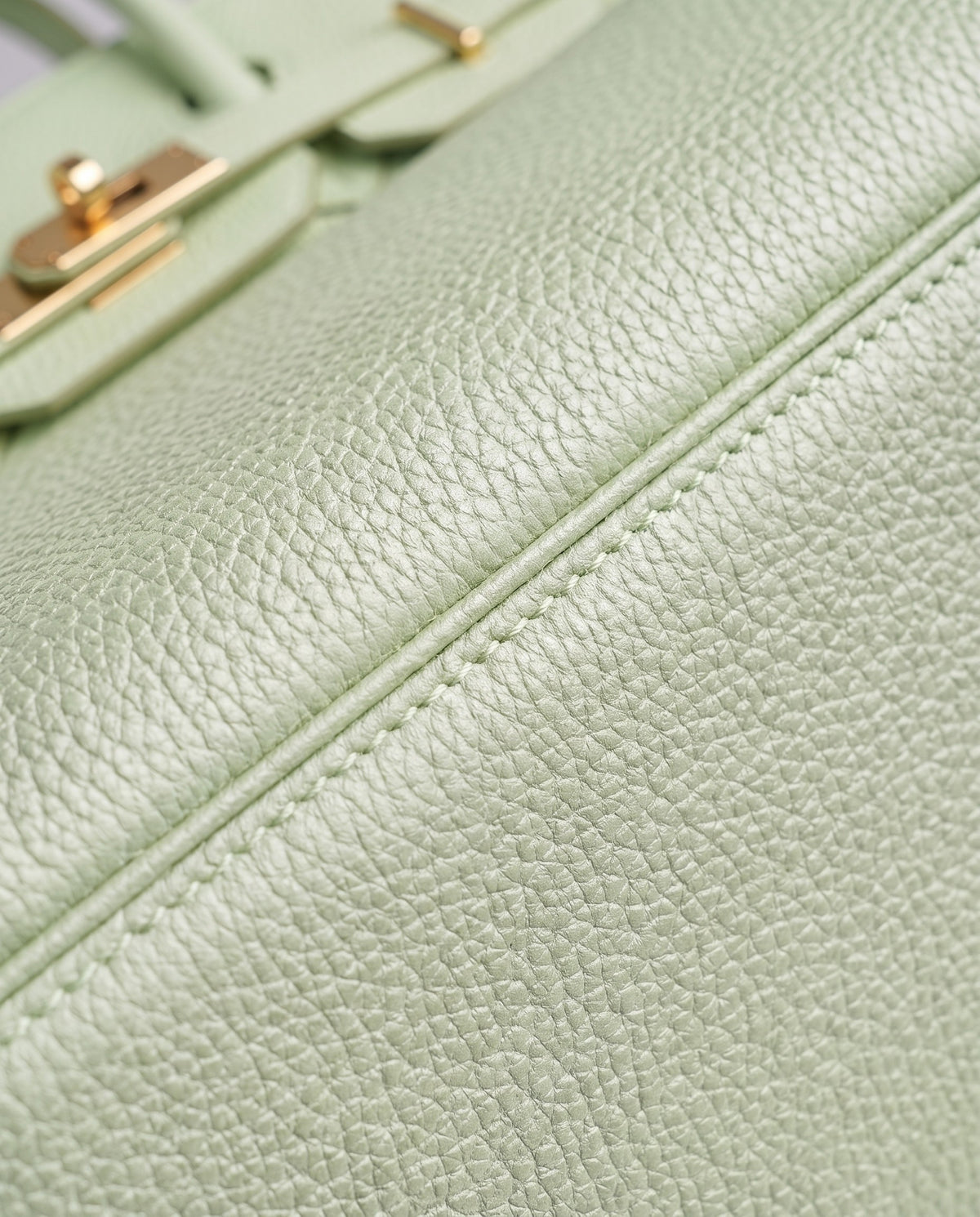 Lock Small leather top-handle bag in Mint – close-up of the pebbled leather and stitching