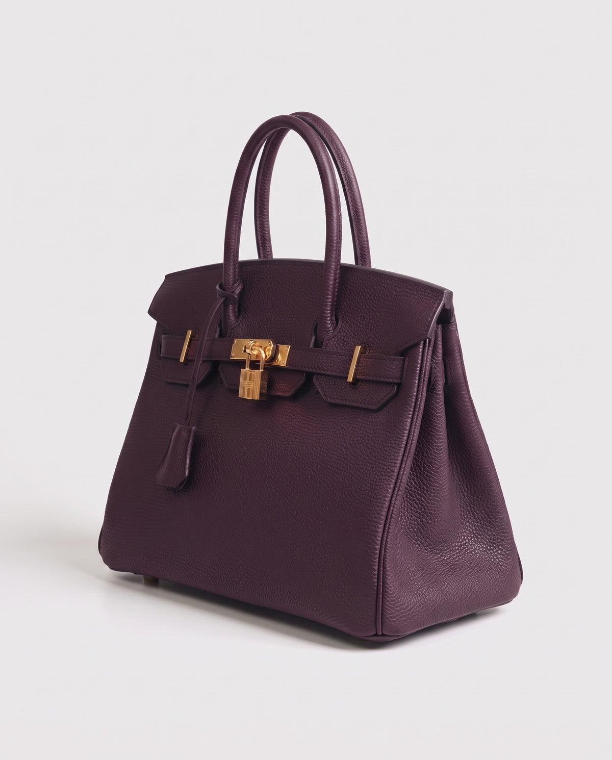 Lock Small leather top-handle bag in Purple – three-quarter view