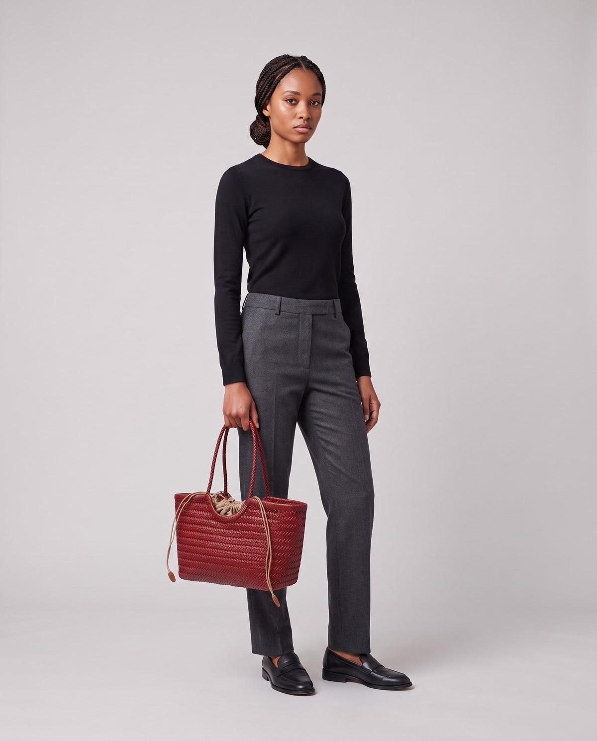 Model holding the Valentina Matera Large bag in Red, full length