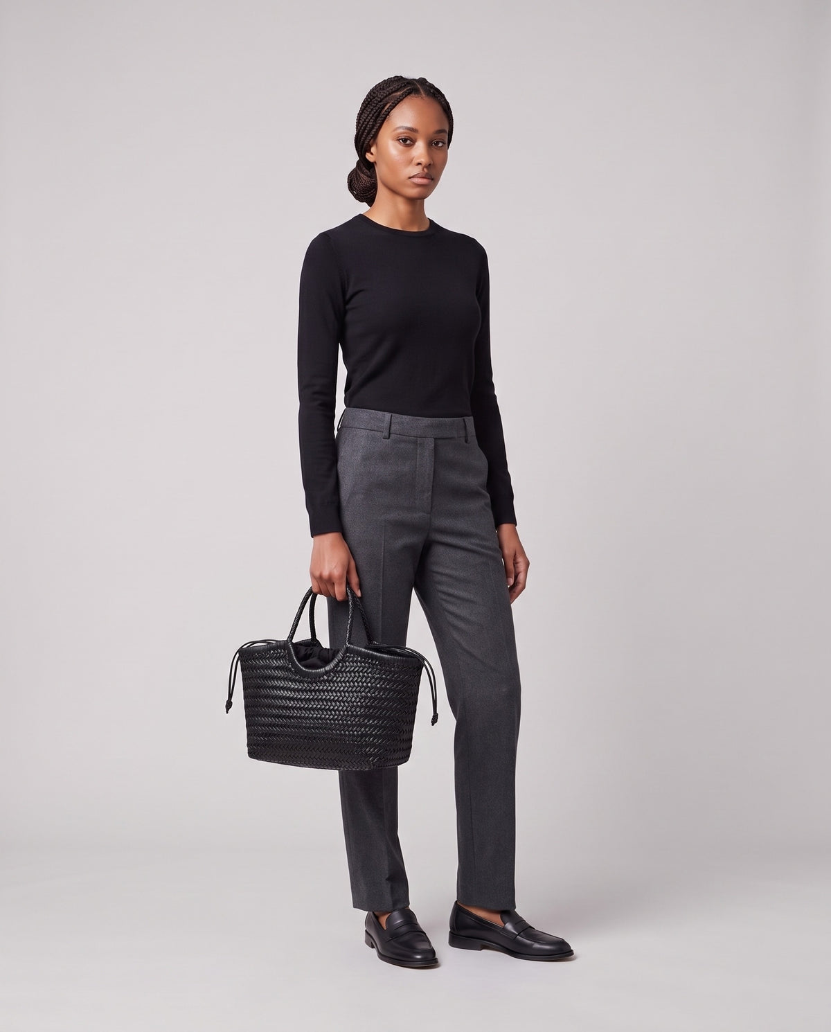 Model holding the Valentina Matera Small bag in Black, full length