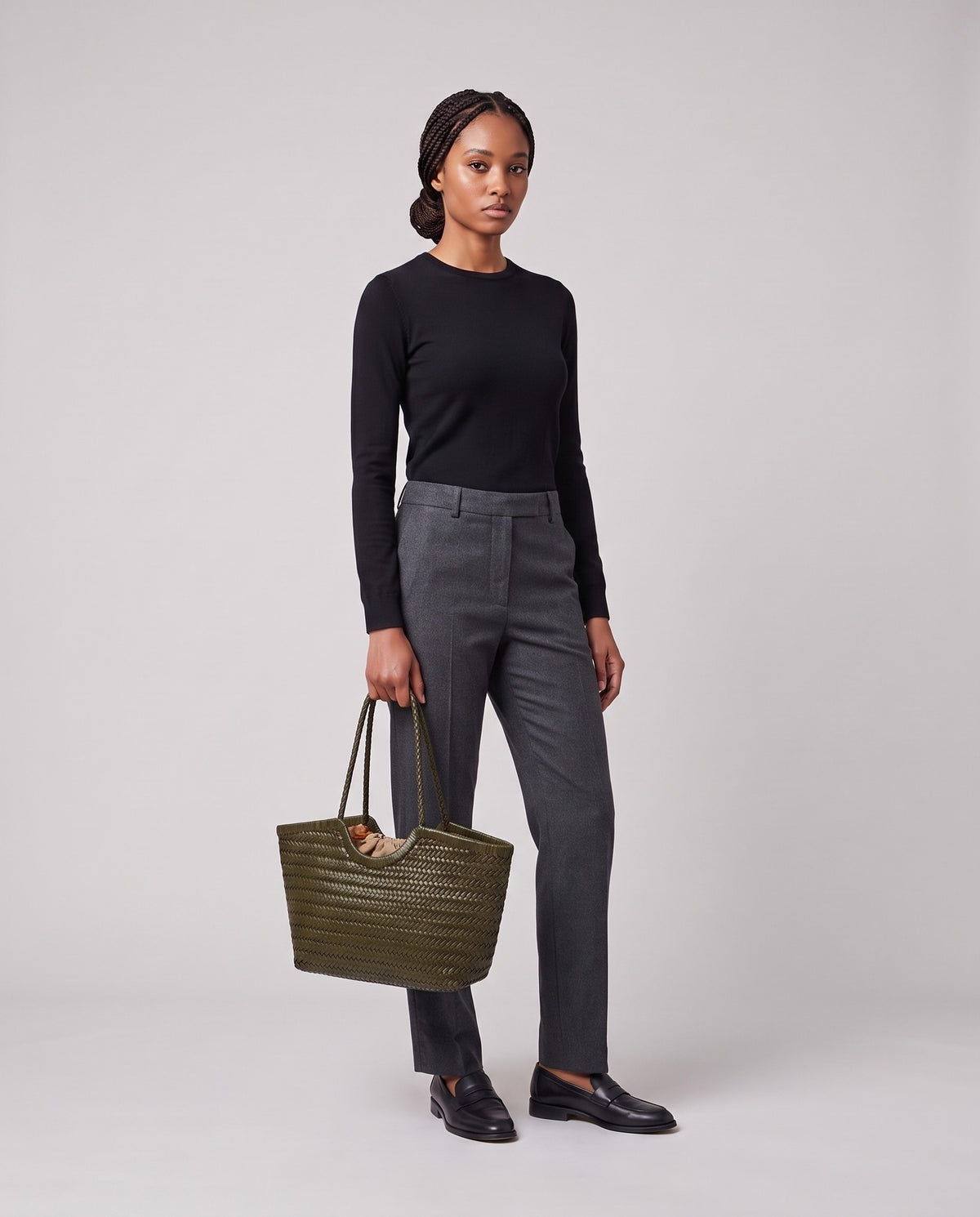 Model holding the Valentina Matera Small bag in Olive, full length