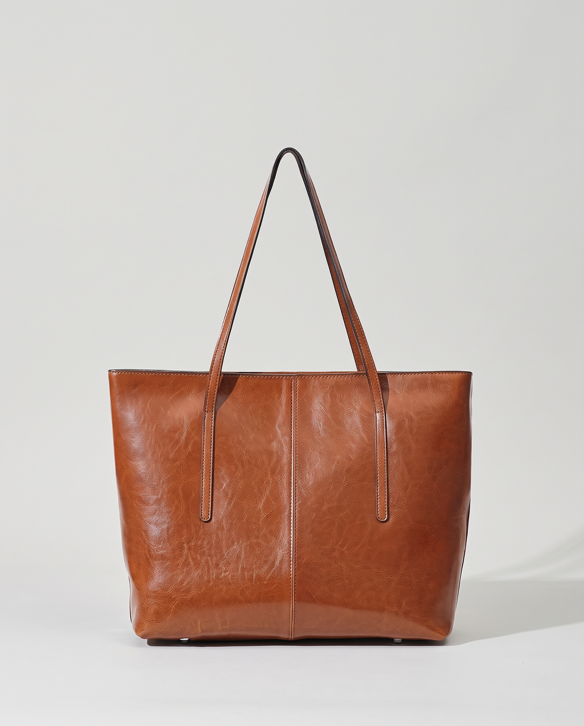 Molo oil-waxed leather tote in cognac, front view