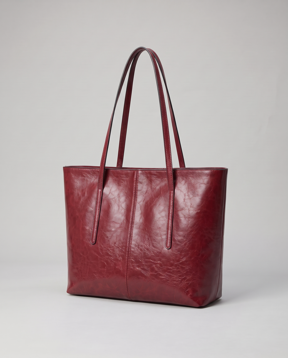 Molo oil-waxed leather tote in red, three-quarter view