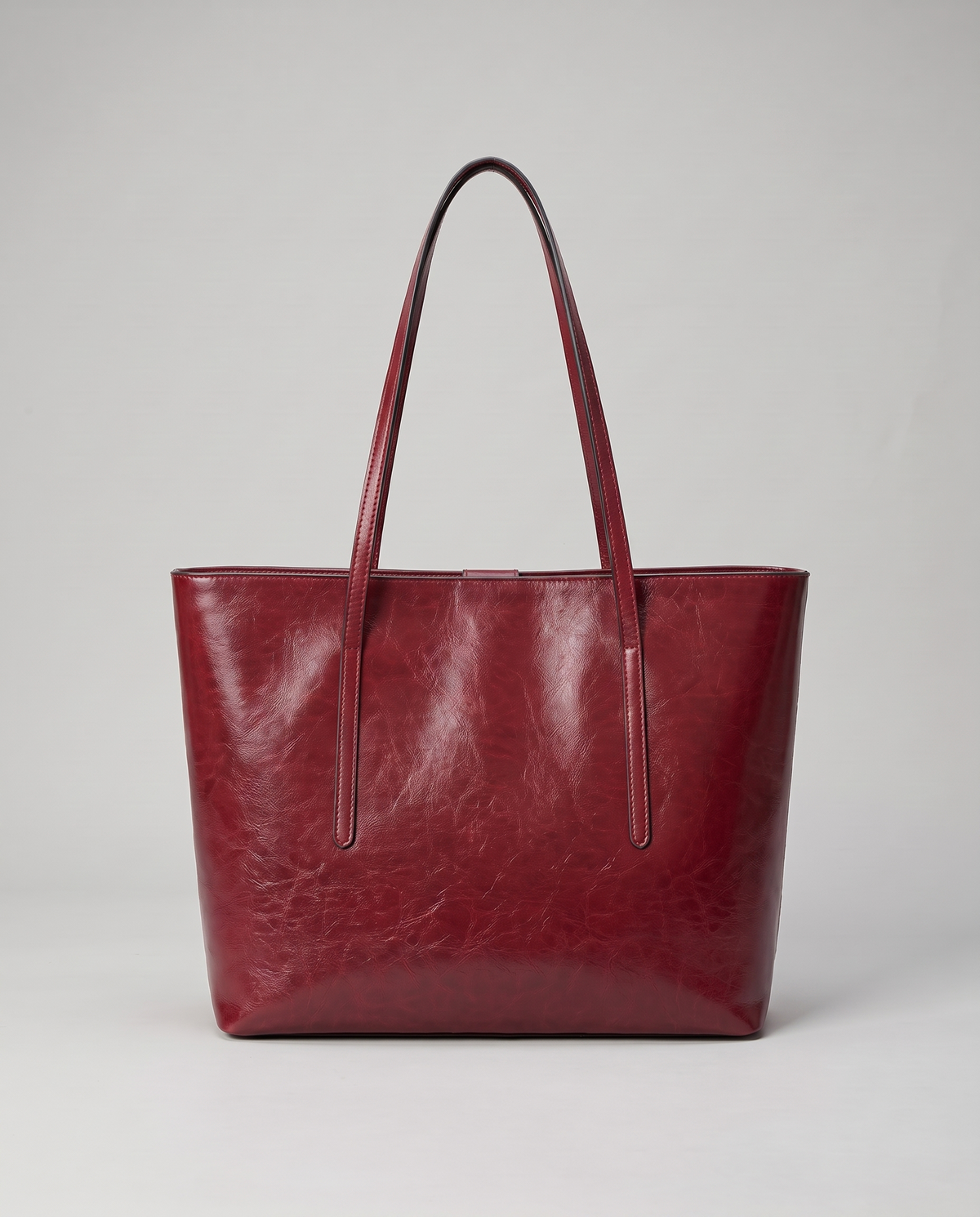 Molo oil-waxed leather tote in red, back view