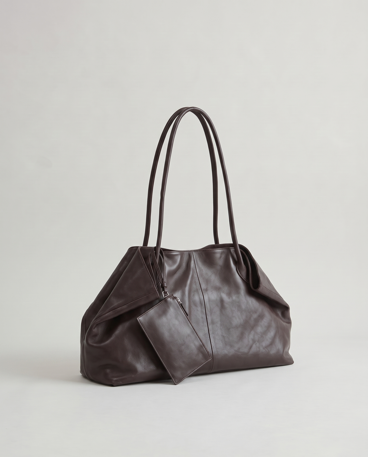 Nido leather tote in Chocolate – three-quarter view