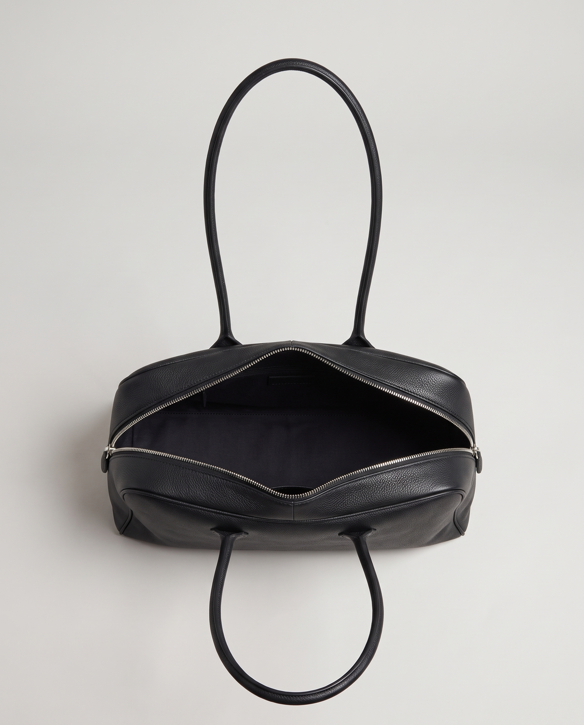 Ora Small leather shoulder bag in Black – view from above with the zip open