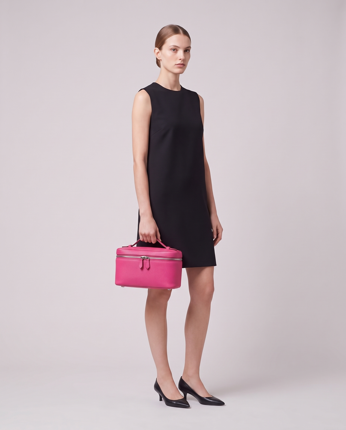 Model holding the Orvieto vanity case in Purple – full-length view