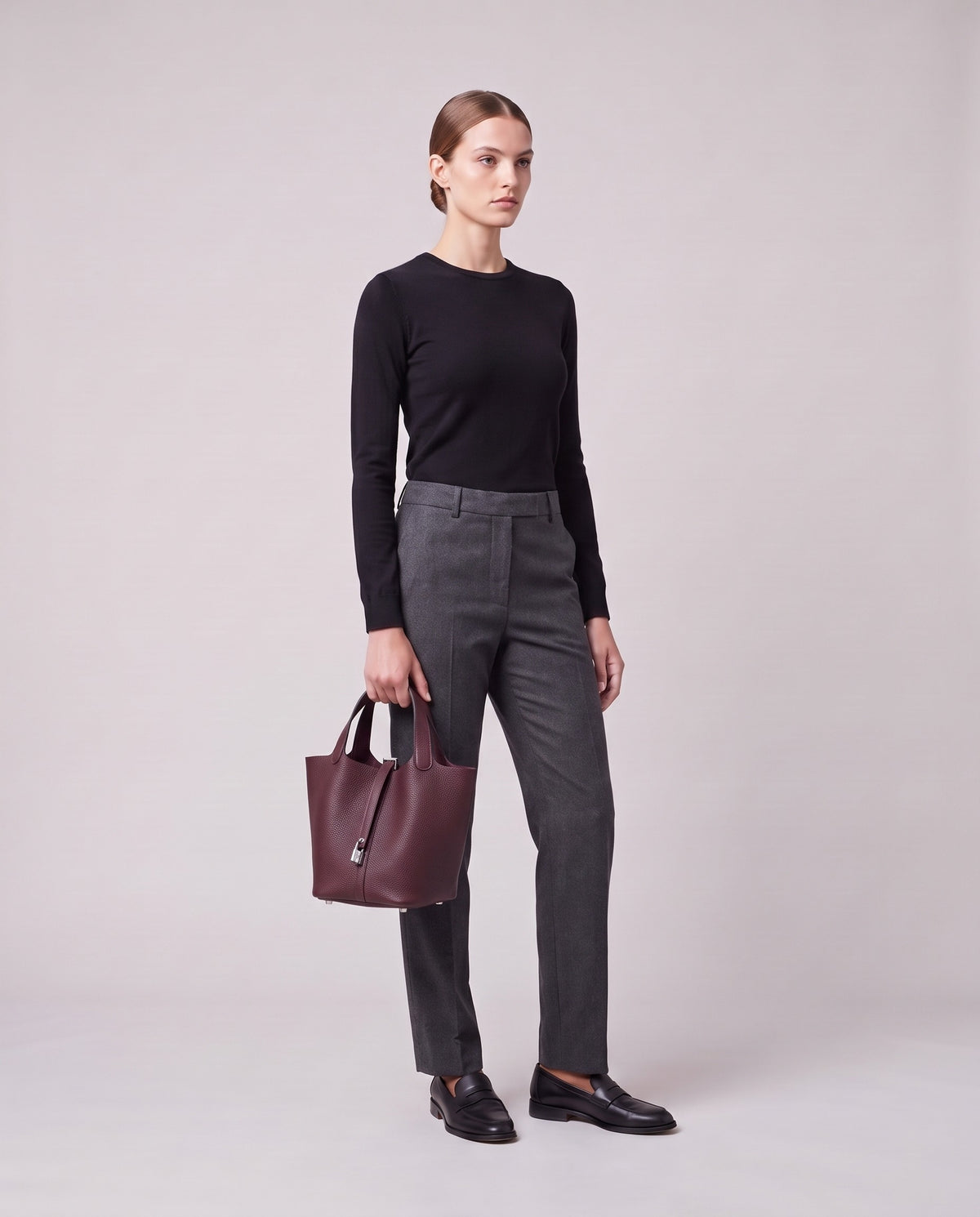 Model holding the Valentina Ostuni Large bag in Plum, full length