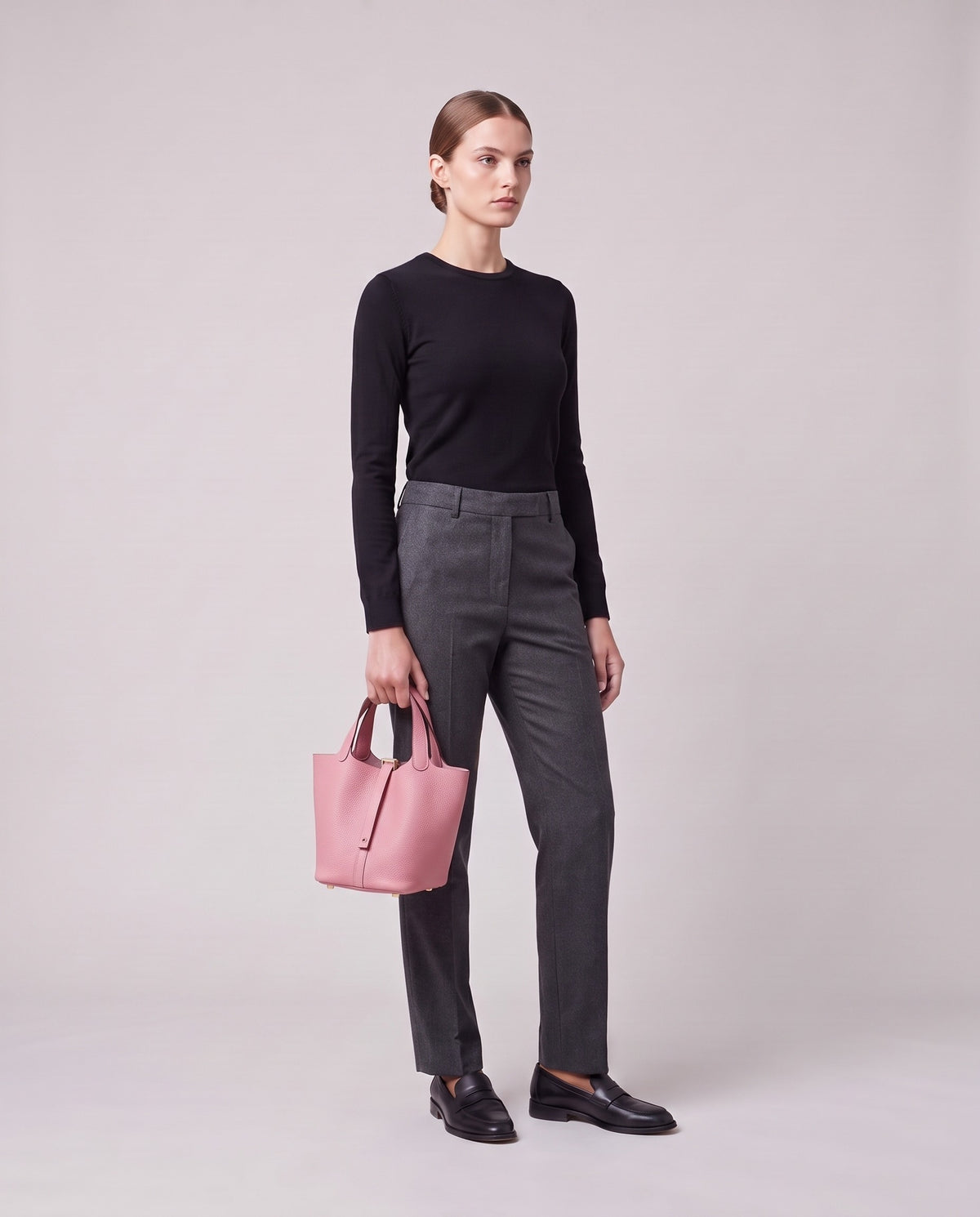 Model holding the Valentina Ostuni Large bag in Rose, full length