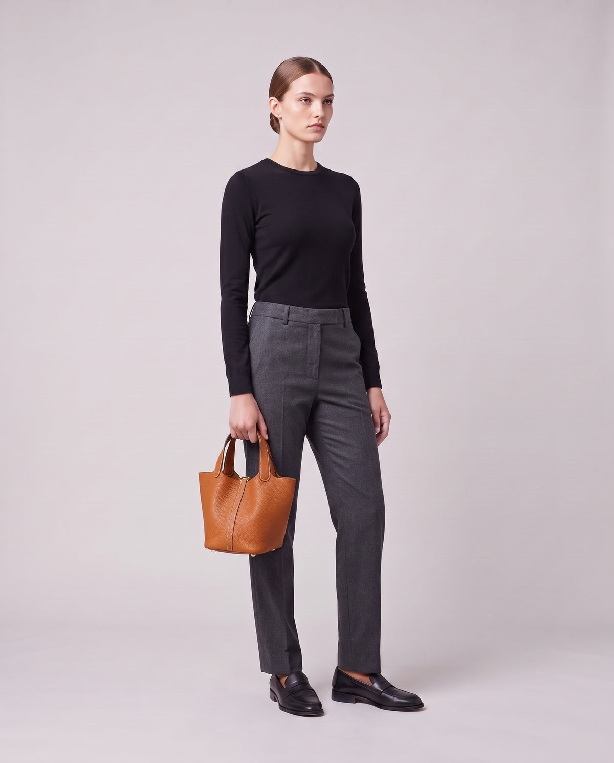 Model holding the Valentina Ostuni Small bag in Caramel, full length