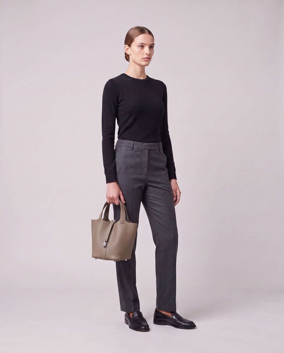 Model holding the Valentina Ostuni Small bag in Stone, full length