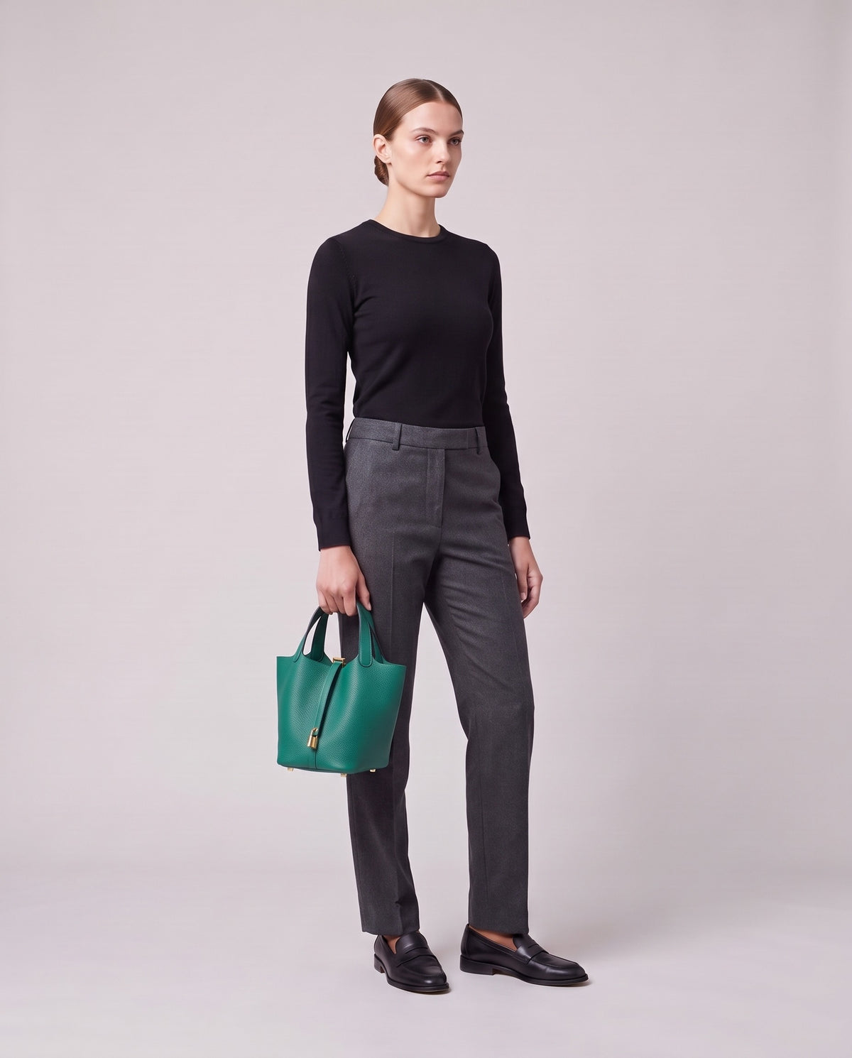 Model holding the Valentina Ostuni Small bag in Teal, full length