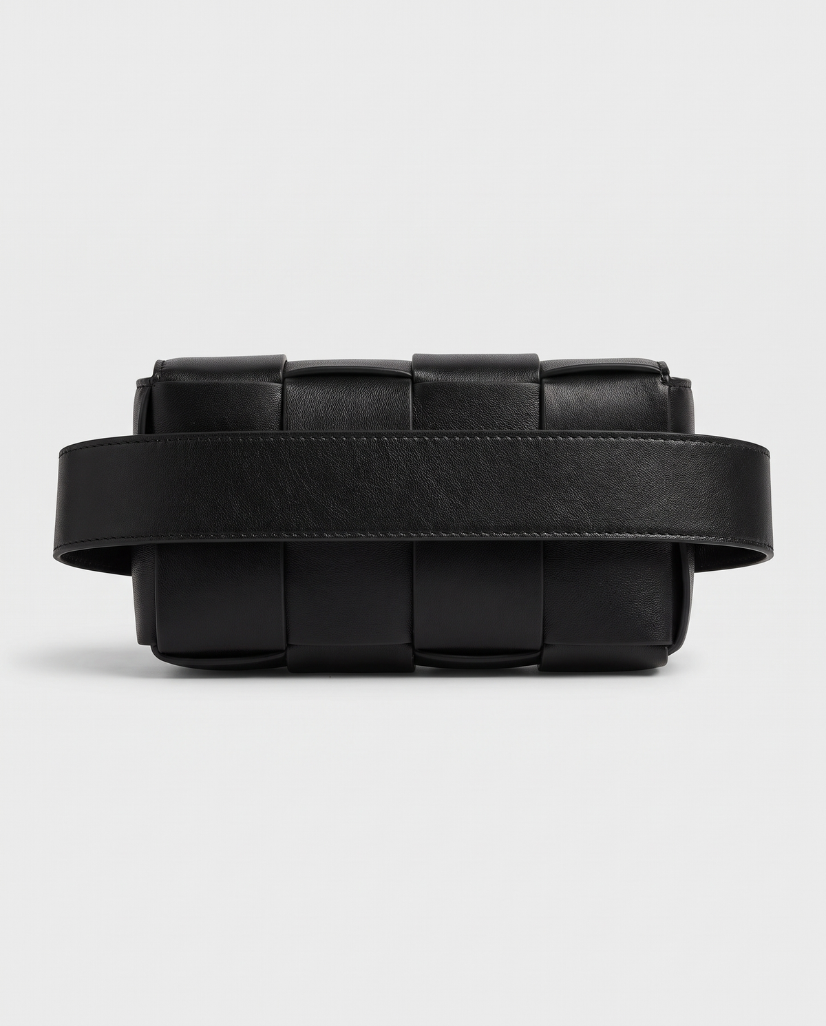 Cassette padded woven leather belt bag in Black – back view showing the belt strap