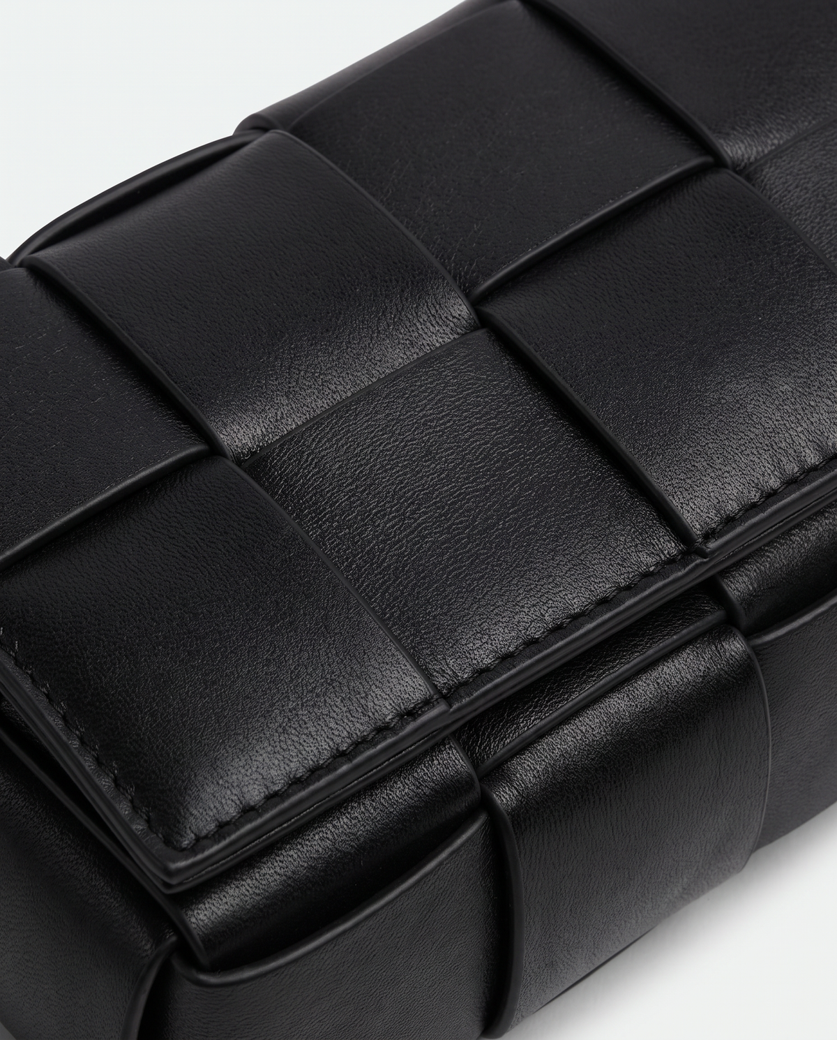 Cassette padded woven leather belt bag in Black – close-up of the padded woven leather