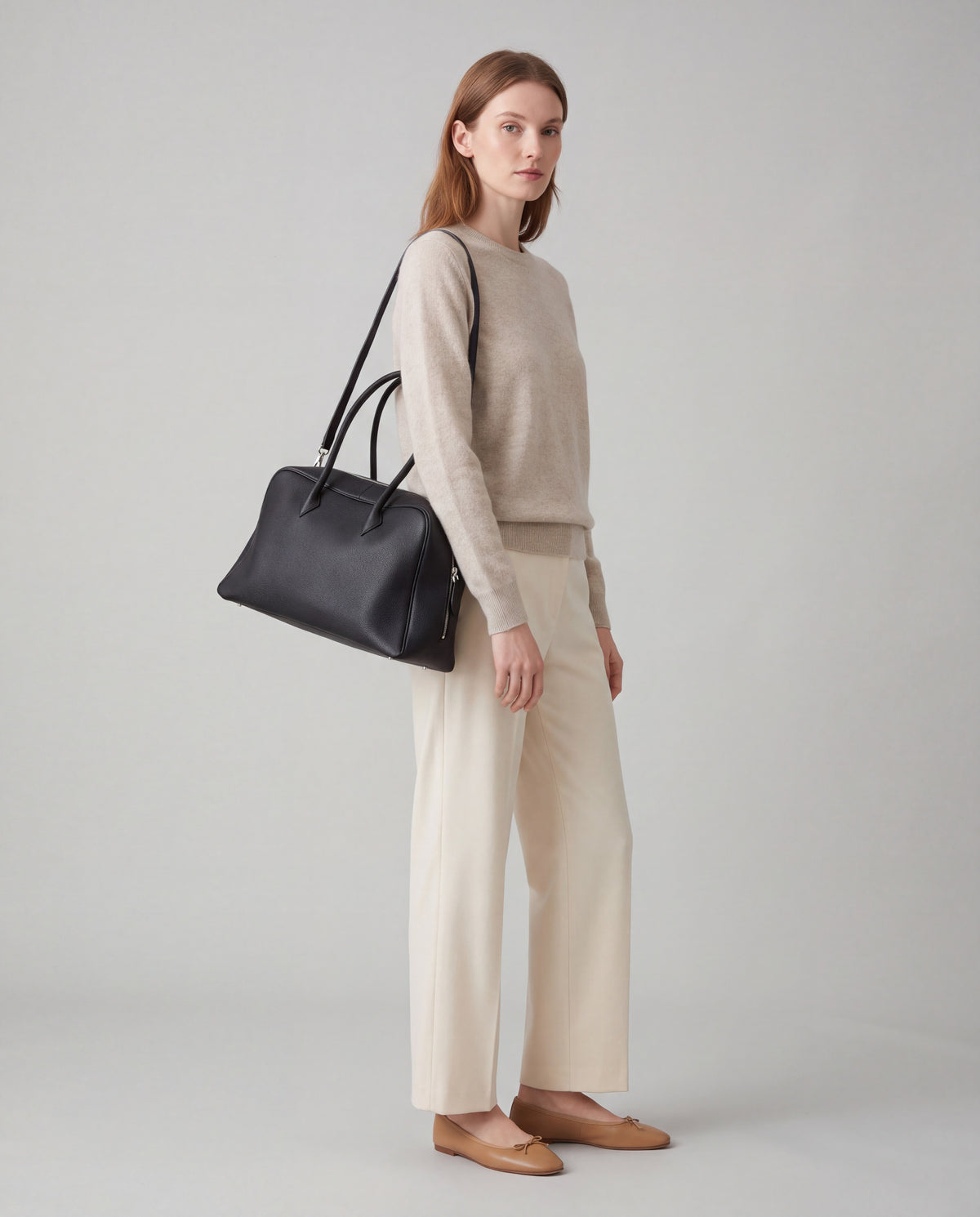 Pillow bag in Black – worn by model, full length