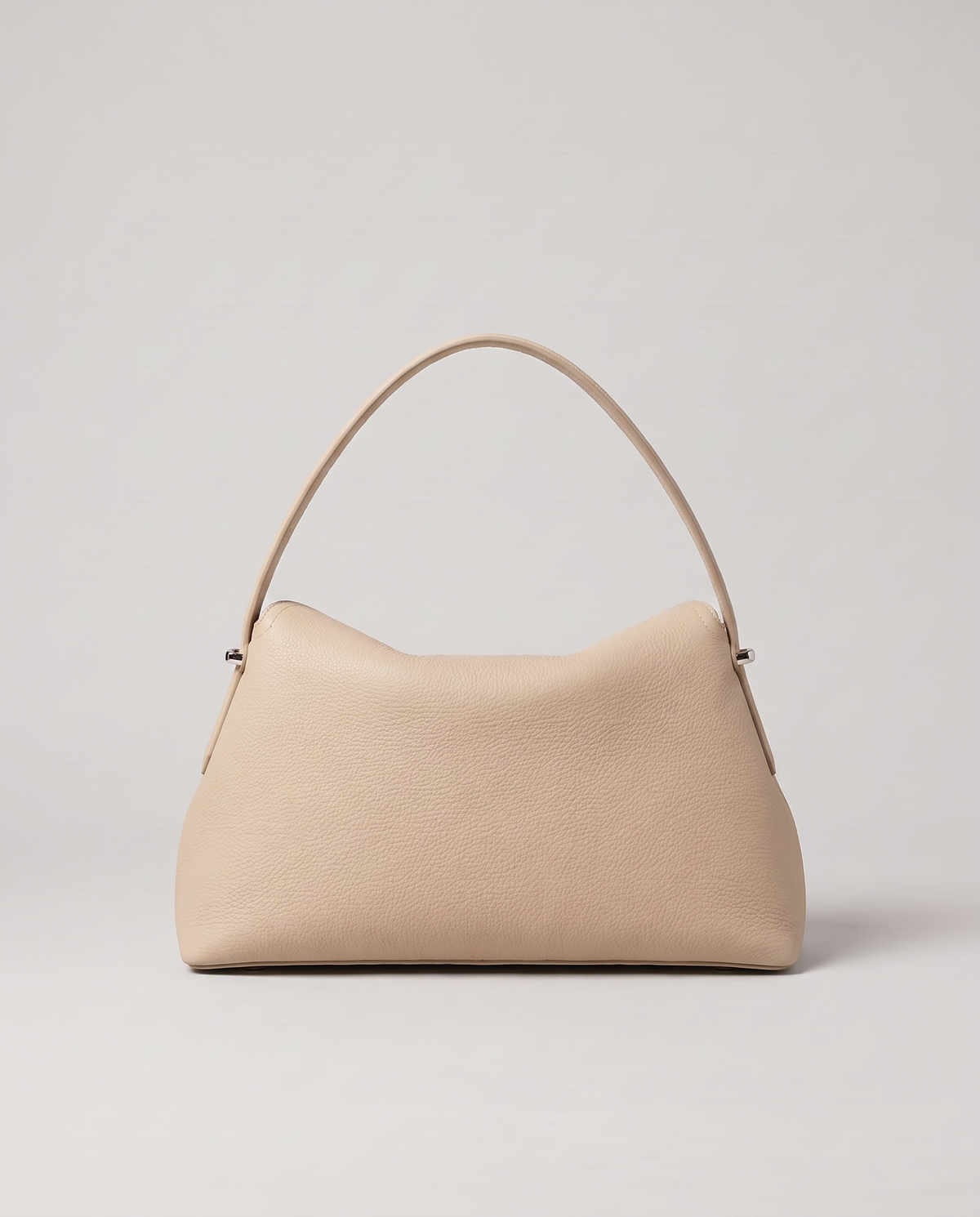 Porto pebbled leather top-handle bag in beige, back view