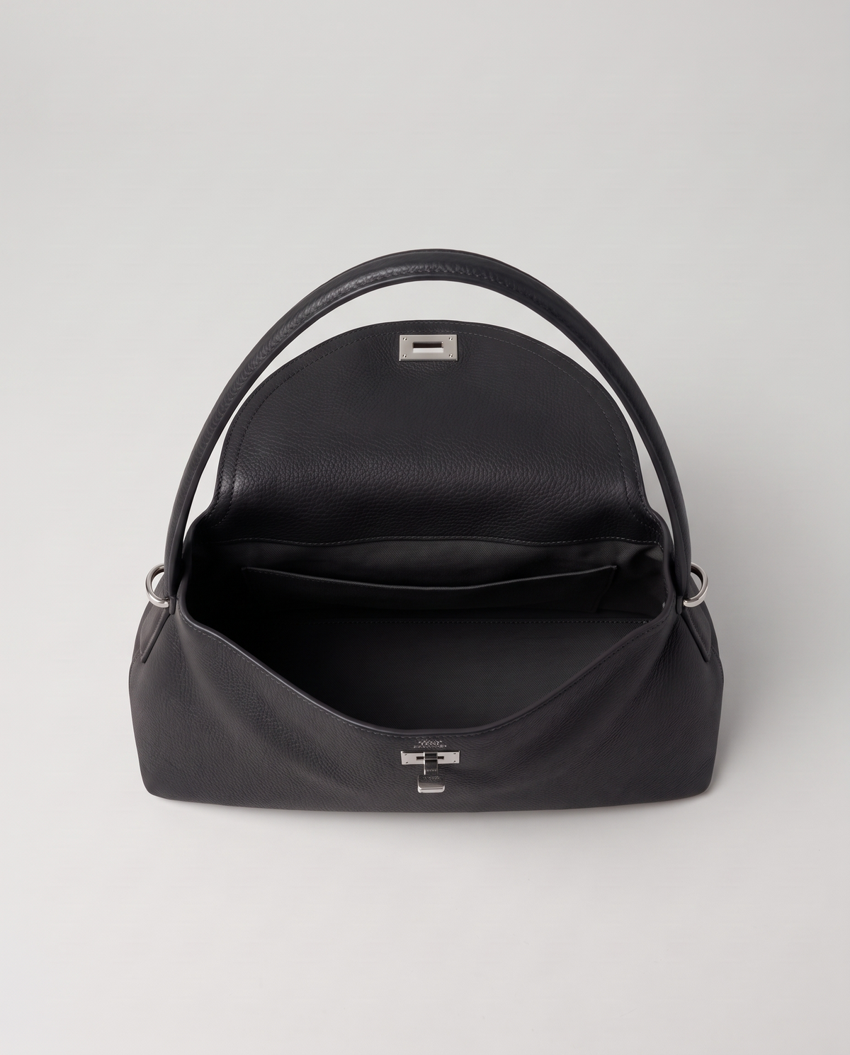 Porto pebbled leather top-handle bag in black, open showing interior