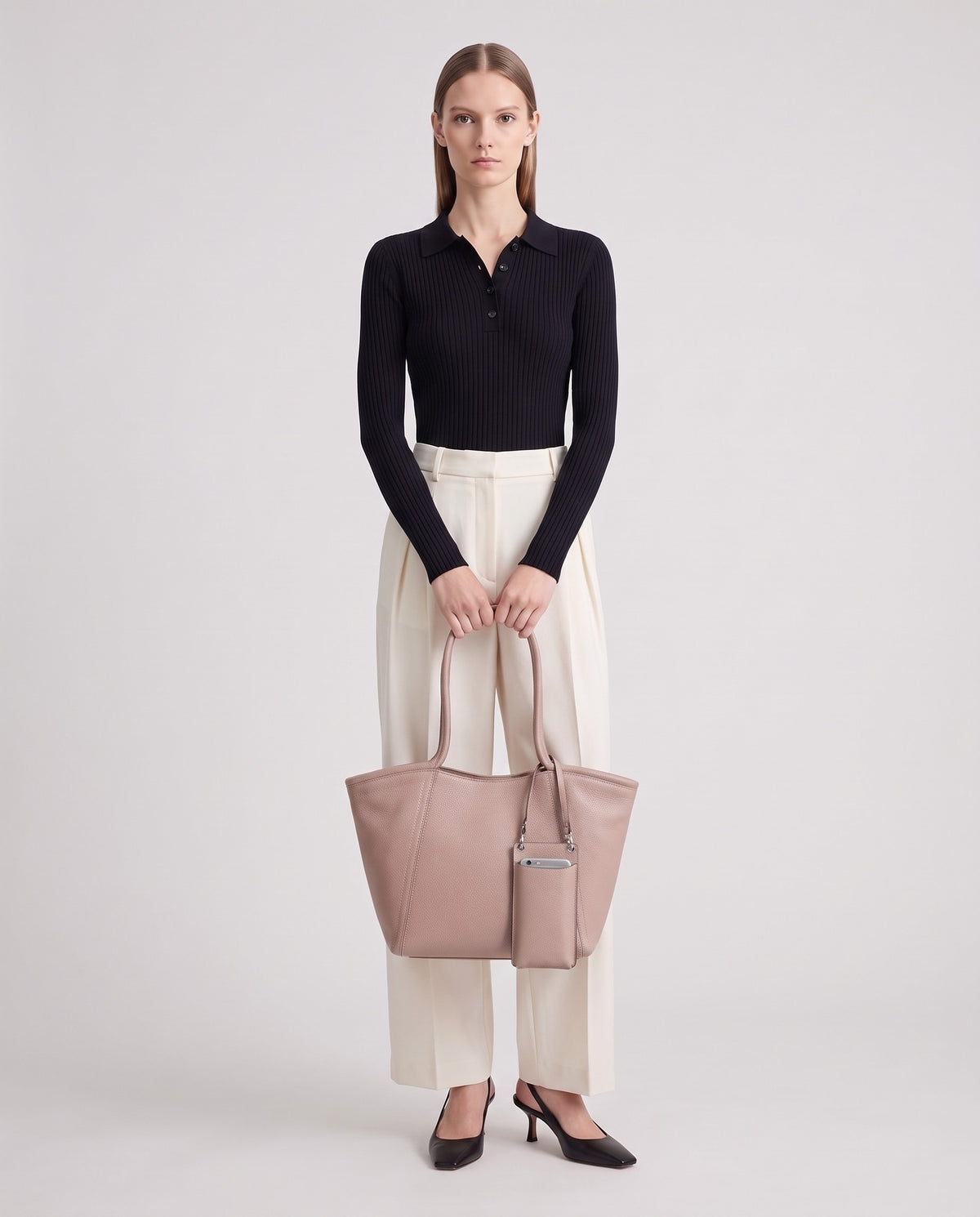 Prima leather tote in Blush – model holding it, full length