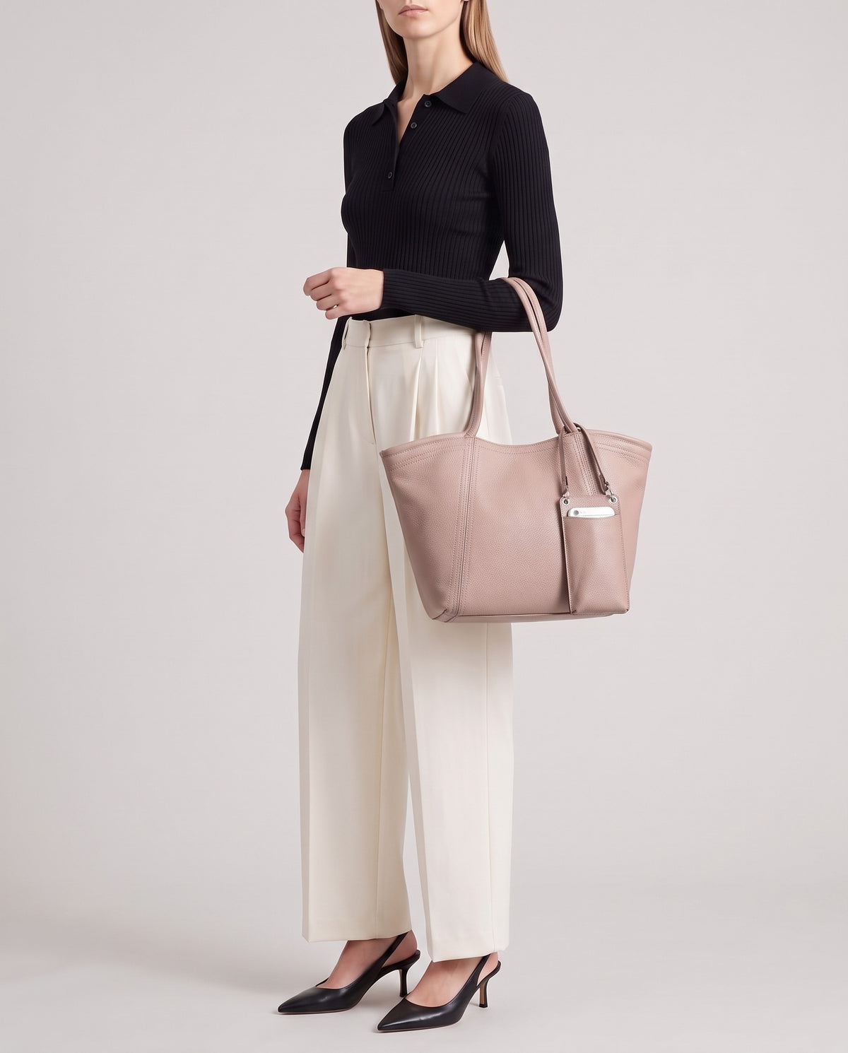 Prima leather tote in Blush – model carrying it