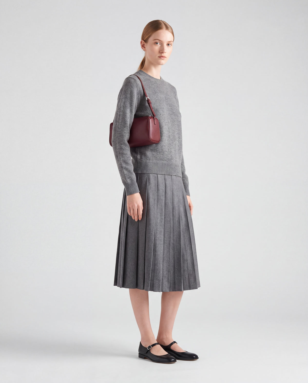 Roll bag in Burgundy – worn by model, full length