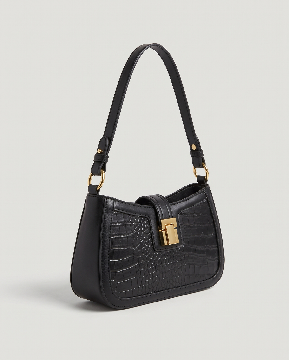 Sable croc-embossed shoulder bag in Black – three-quarter view