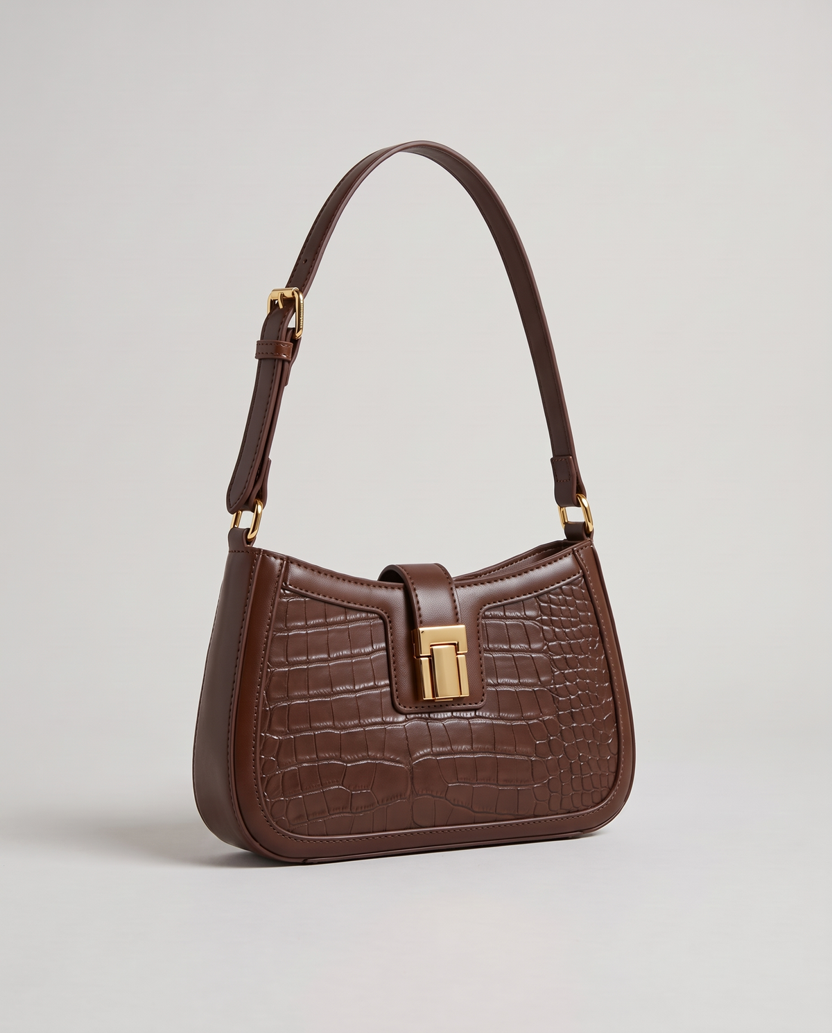 Sable croc-embossed shoulder bag in Brown – three-quarter view