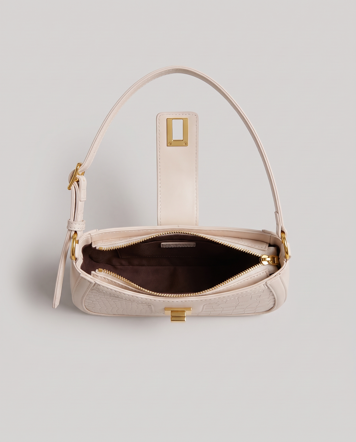 Sable croc-embossed shoulder bag in Chalk – open, showing the zip and lined interior