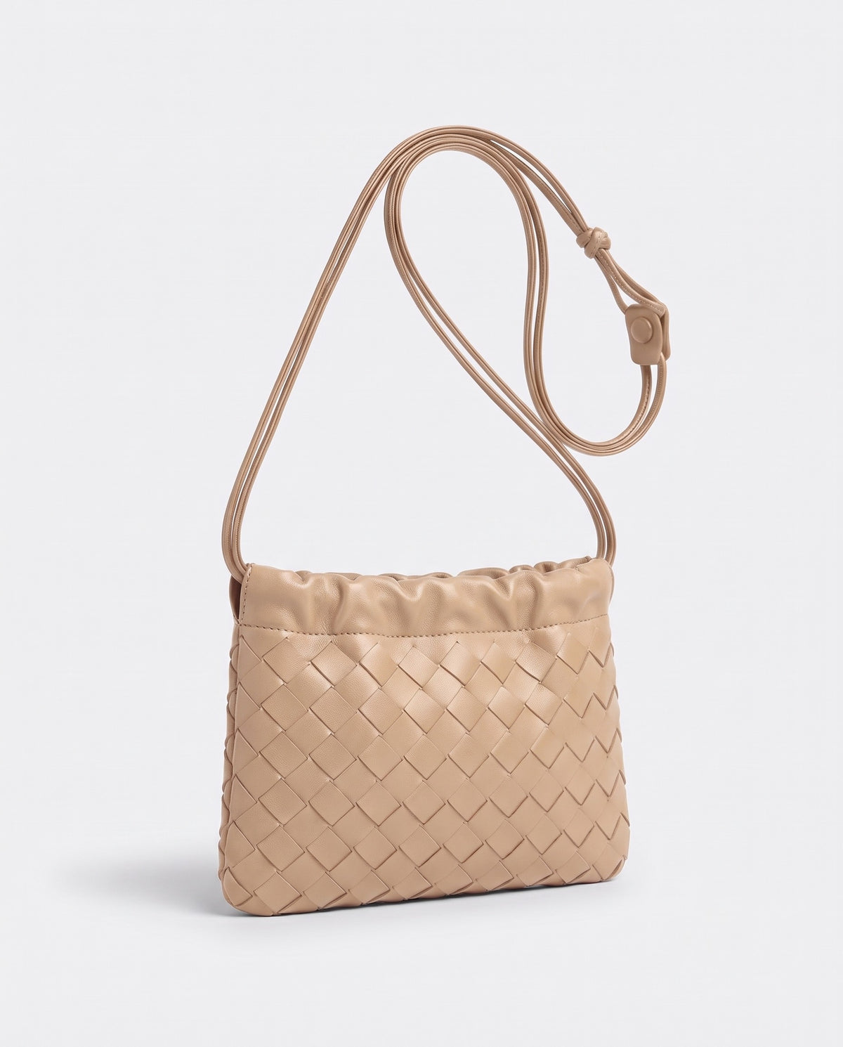 Serata woven leather clutch in Beige – three-quarter view