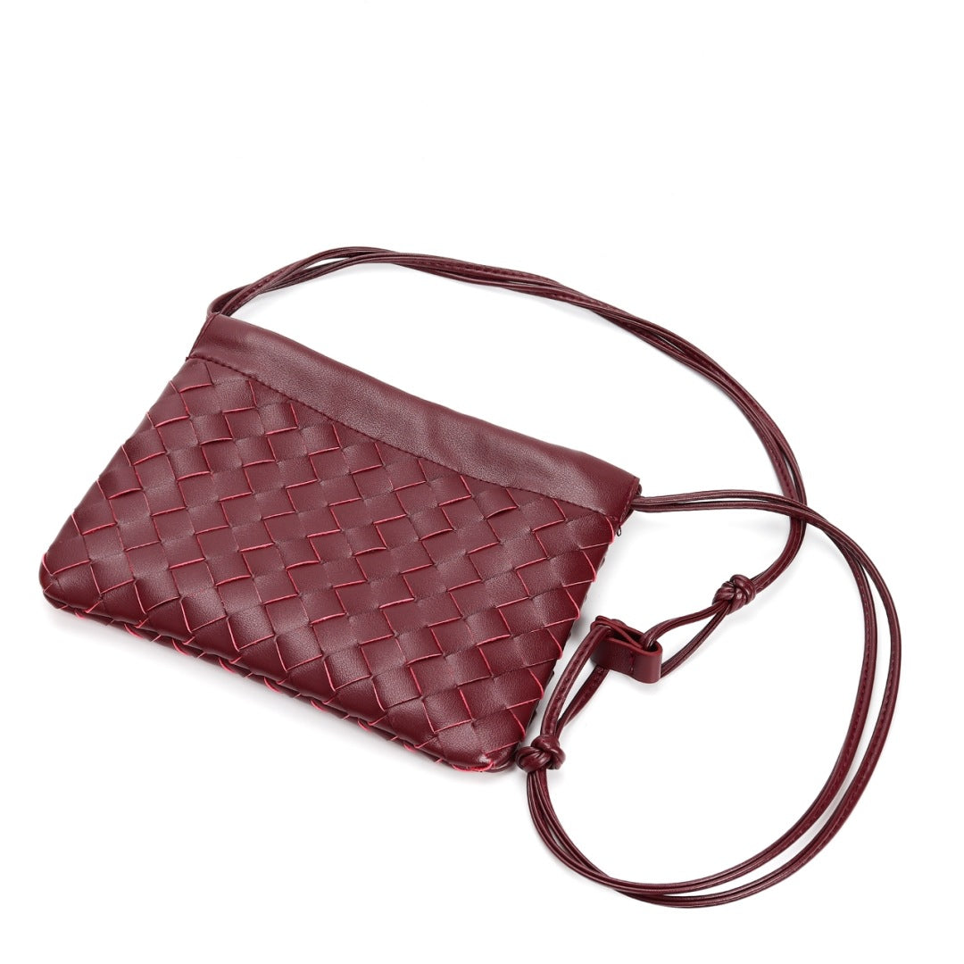 Slim Clutch (Andiamo) genuine leather woven crossbody bag in burgundy - front view