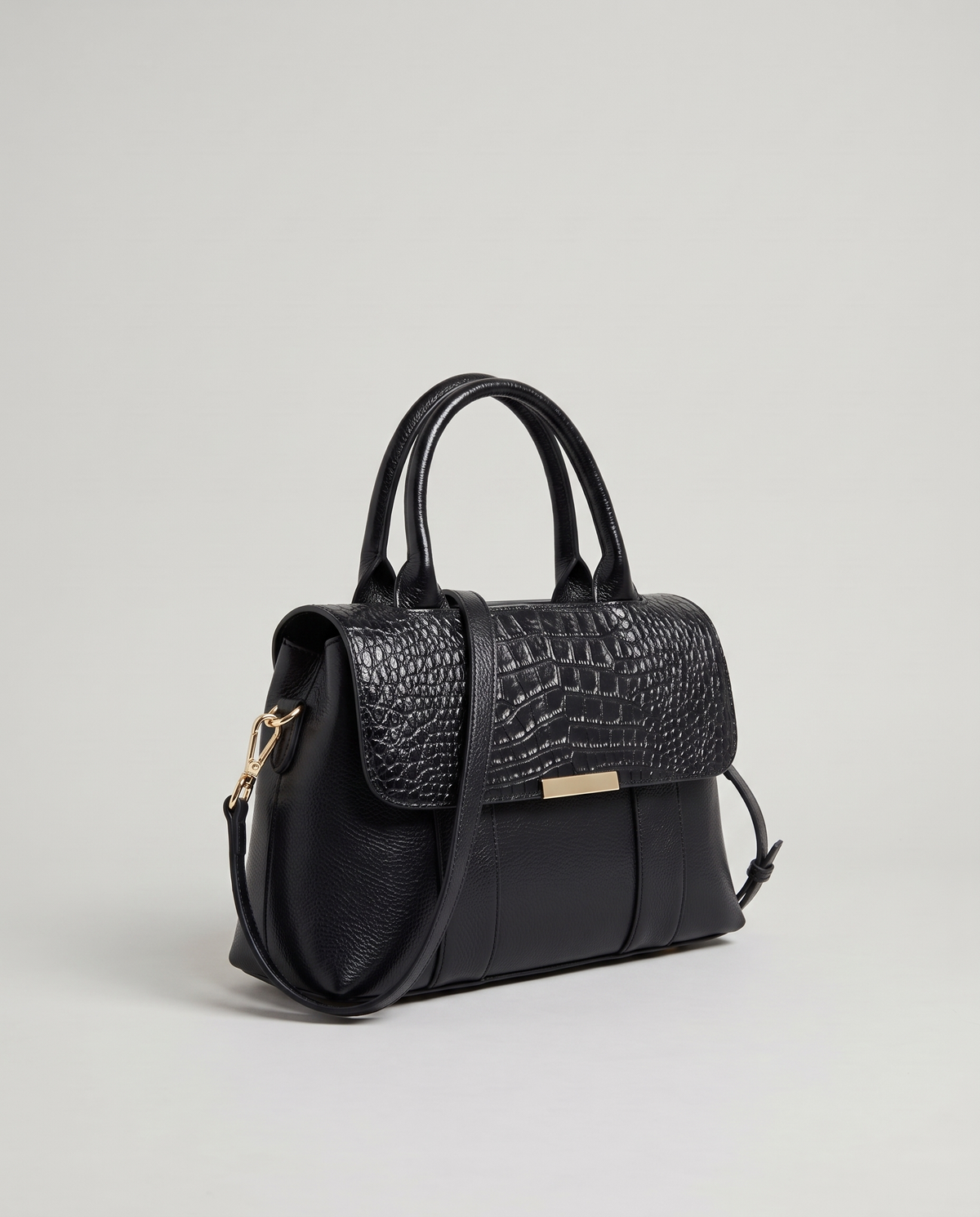 Sloane croc-embossed leather handbag in Black – three-quarter view