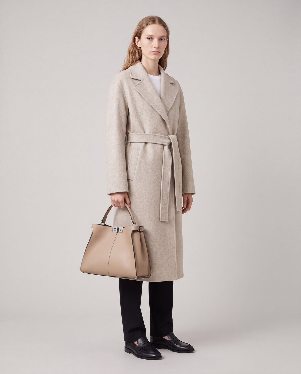 Sola bag in Beige – worn by model, full length