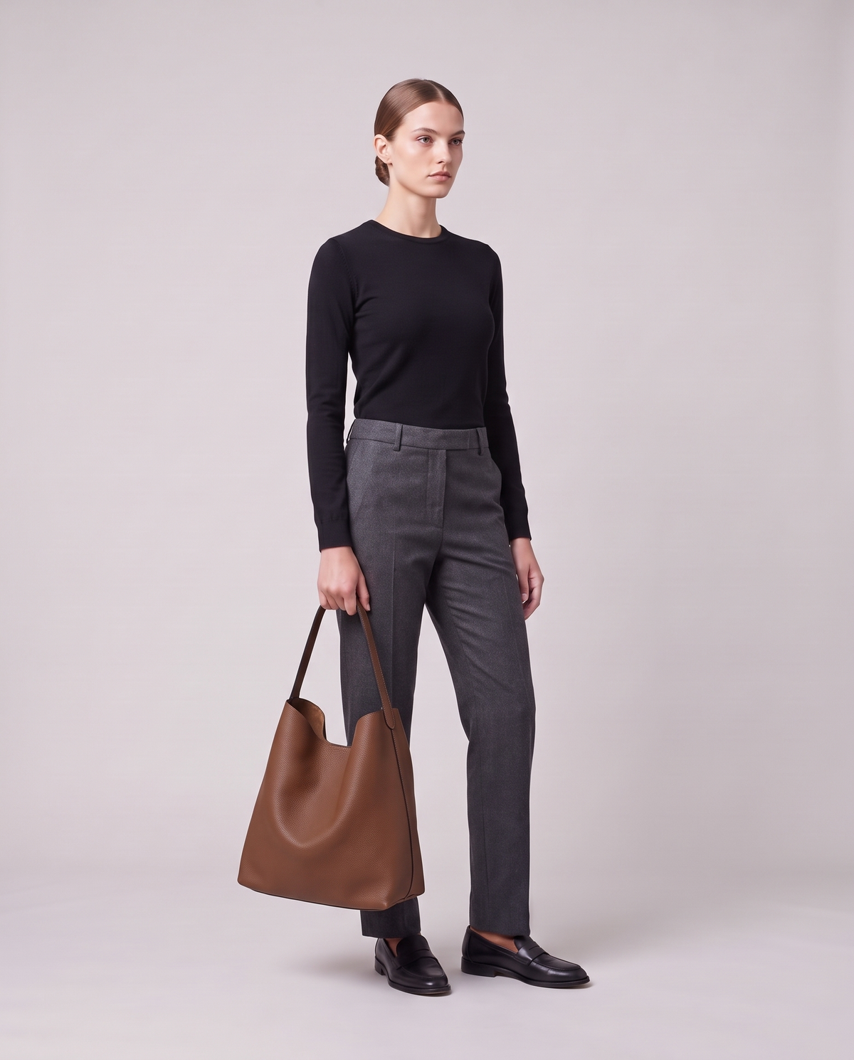 Model holding the Valentina Tela Small bag in Brown, full length