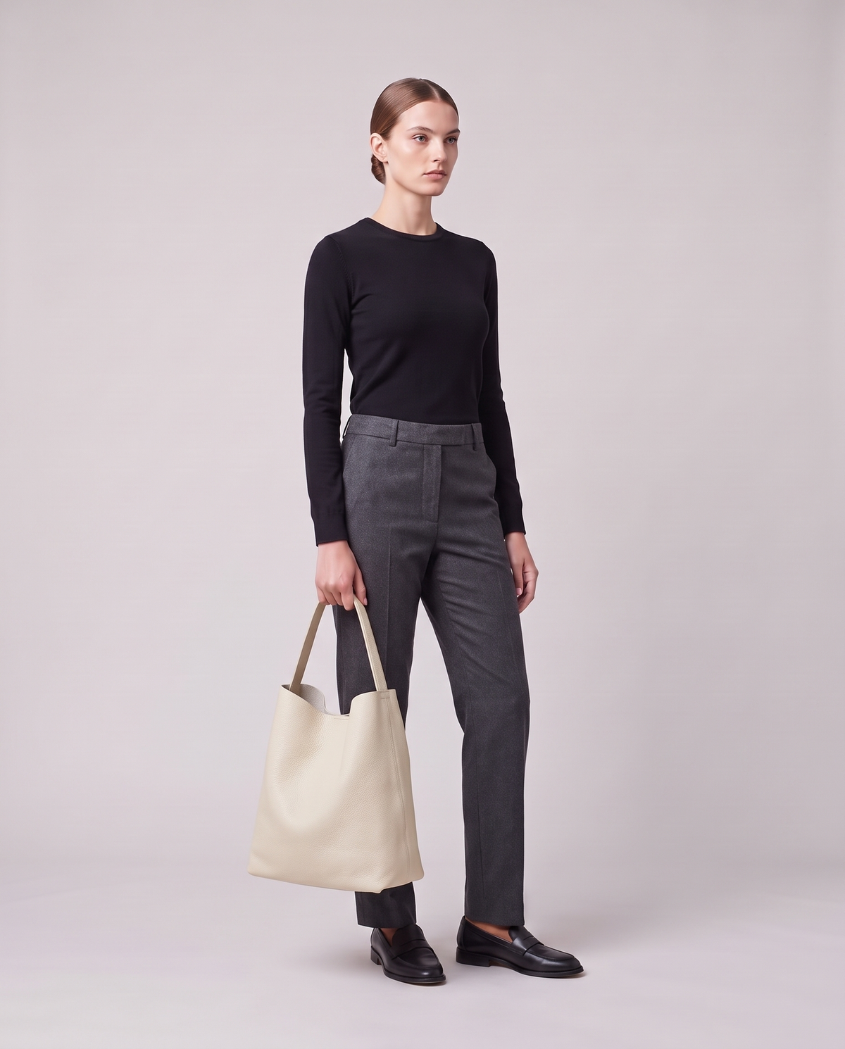 Model holding the Valentina Tela Small bag in Cream, full length