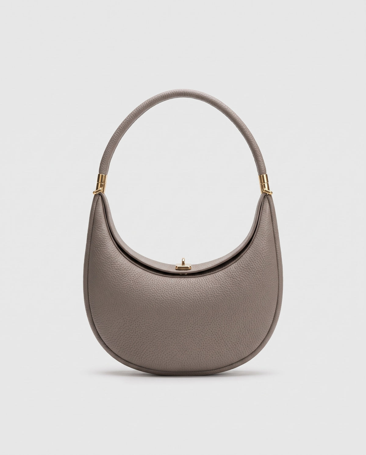 Todi pebbled leather crescent bag in Taupe – front view