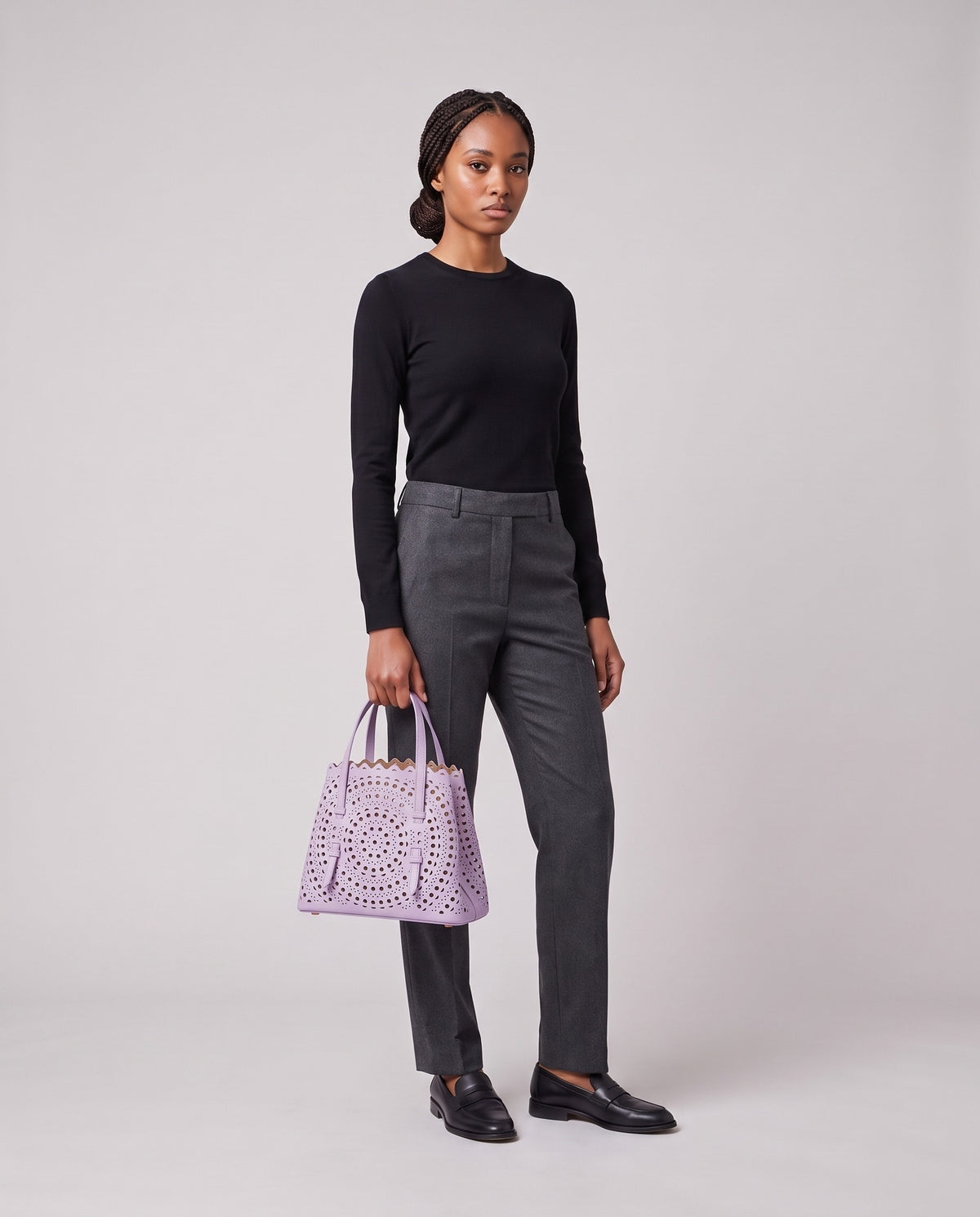 Model holding the Valentina Urbino Small bag in Lavender, full length