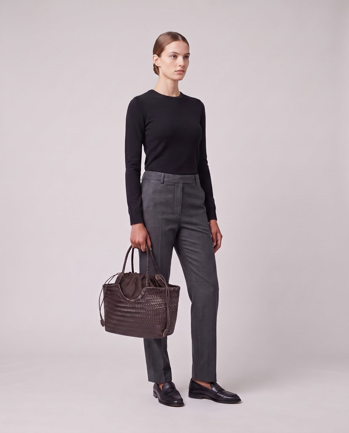 Model holding the Valentina Gubbio bag in Chocolate, full length