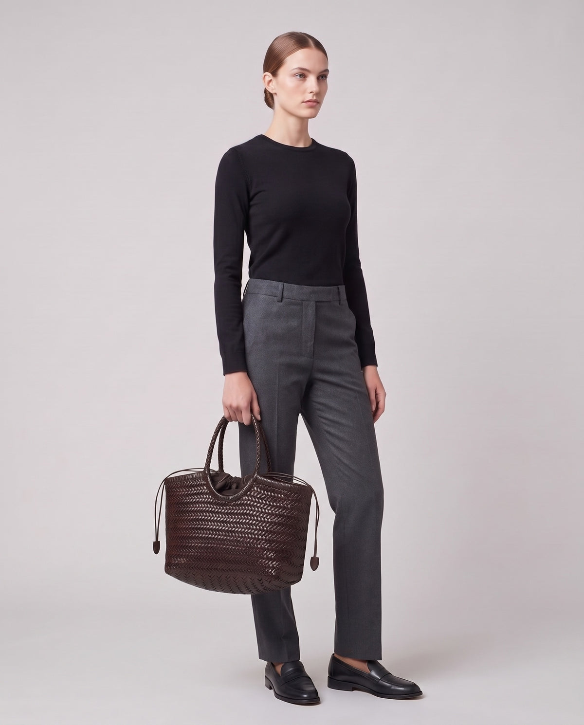 Model holding the Valentina Lecce bag in Chocolate, full length