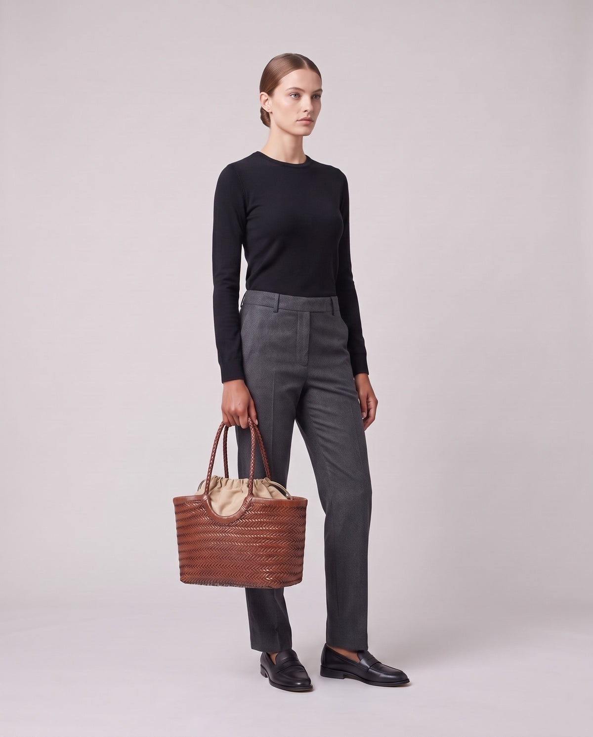 Model holding the Valentina Lecce bag in Cognac, full length