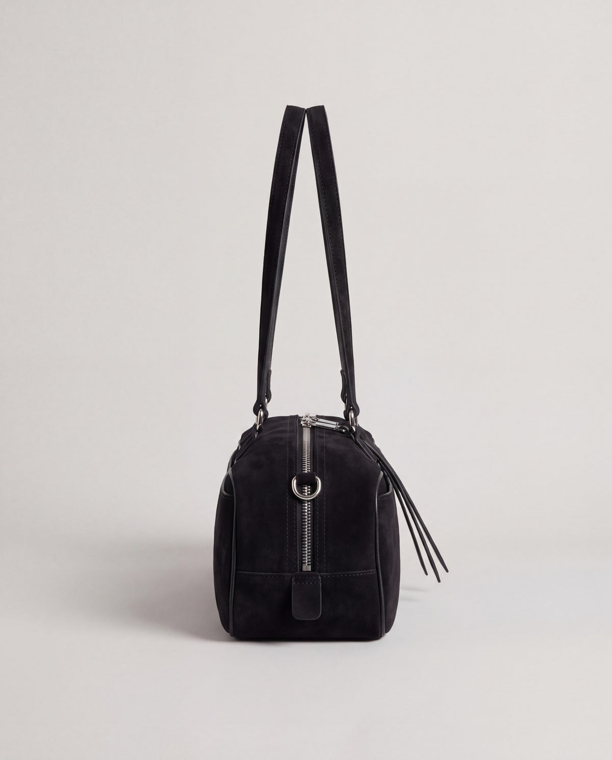 Valentina Linea suede shoulder bag in Black, side view showing the end zip