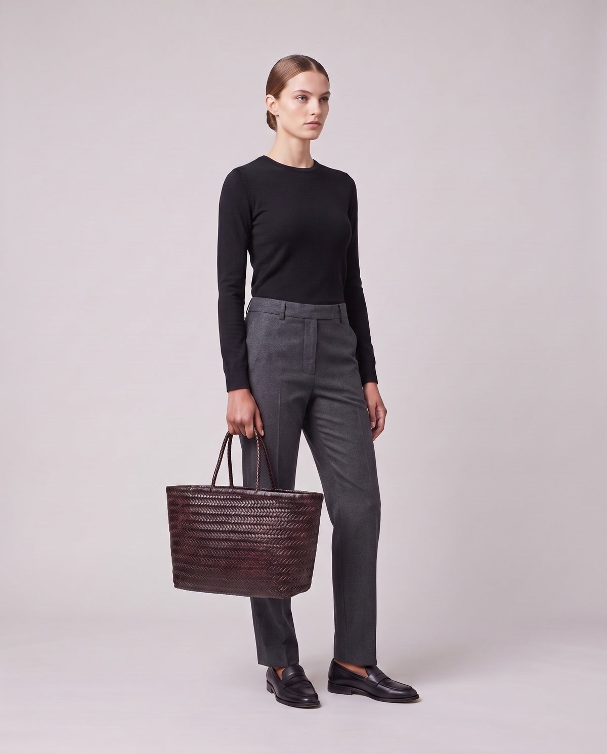 Model holding the Valentina Noto Large bag in Espresso, full length