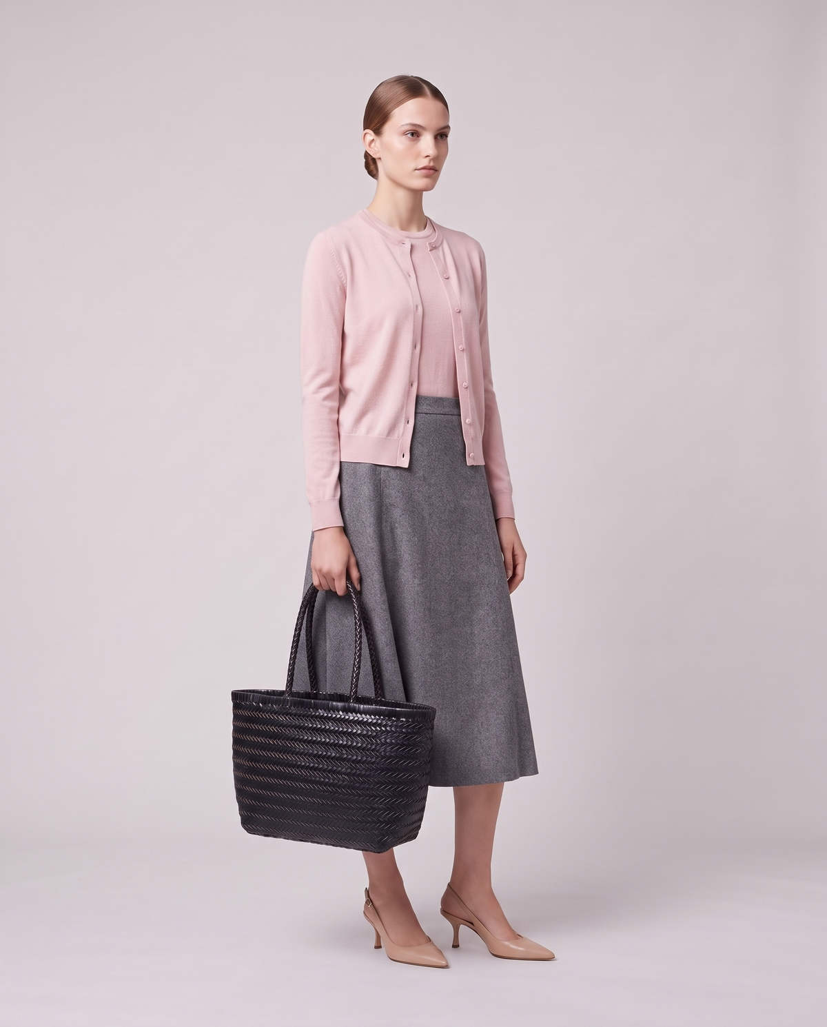 Model holding the Valentina Noto Large bag in Onyx, full length