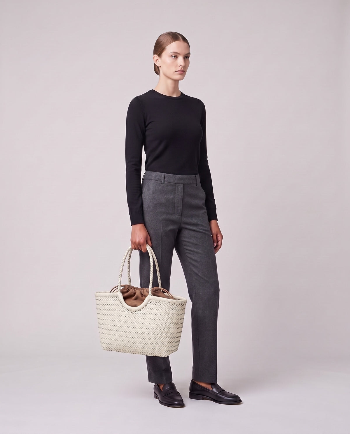 Model holding the Valentina Noto Large bag in White, full length